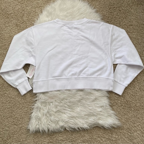 {Pink Lily} MERRY VARSITY WHITE CROPPED CORDED GRAPHIC SWEATSHIRT - Women’s - Picture 5 of 6